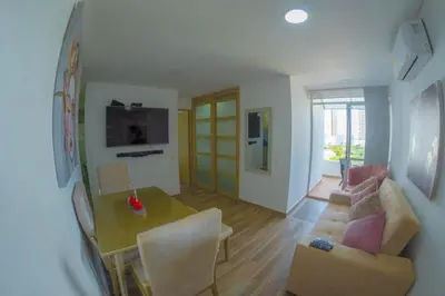 a living room with a table and a couch at Exclusive House Cartagena in Cartagena de Indias
