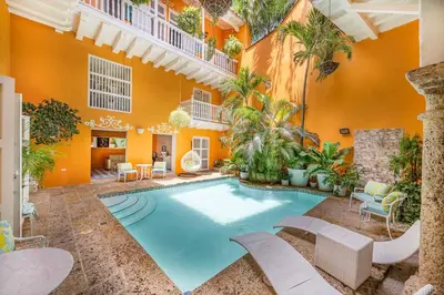 a swimming pool in the middle of a house at Amazing Colonial Mansion Old City Cartagena in Cartagena de Indias