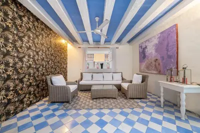 a living room with a couch and chairs and a table at Amazing Colonial Mansion Old City Cartagena in Cartagena de Indias