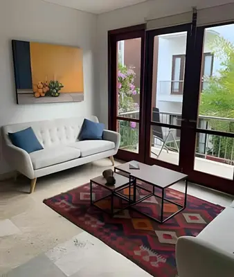 a living room with a couch and a table at 212 Cartagena Walled City Magical Apt in Cartagena de Indias