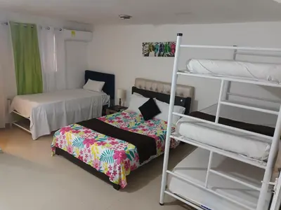 a room with two bunk beds and a bed at buenavista class in Barranquilla