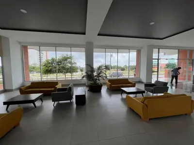 a large room with couches and tables and windows at Excelente Apartamento en Villa Campestre, Barranquilla in Puerto Colombia