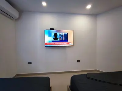 a flat screen tv on a wall in a room at APARTAMENTO MODERNO EL LAGUITO JUNTO AL MAR 705 in Cartagena de Indias