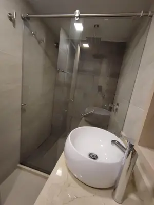 a bathroom with a white sink and a shower at APARTAMENTO MODERNO EL LAGUITO JUNTO AL MAR 705 in Cartagena de Indias