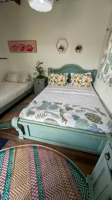 a bedroom with a bed and a couch at Mio Mio Beach in Baru