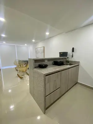 a kitchen with a counter and a helicopter in a room at Ocean Drive Beach House - Cartagena in Cartagena de Indias