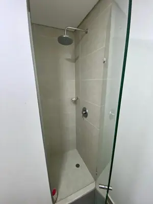 a shower with a glass door in a bathroom at Ocean Drive Beach House - Cartagena in Cartagena de Indias
