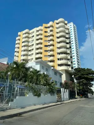 a large apartment building with a fence in front of it at Cabrero Beach 1212 in Cartagena de Indias