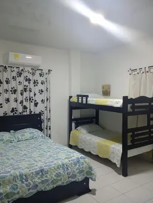 a bedroom with two bunk beds in a room at Cabaña Rochy in Coveñas