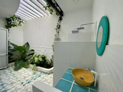 a bathroom with a wooden sink in a room at Casa Amarilla in Santa Veronica