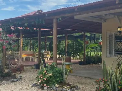 a wooden pergola with a bench and a table at Cabañas Paulamar - Apto 2 - Tolu in La Gloria