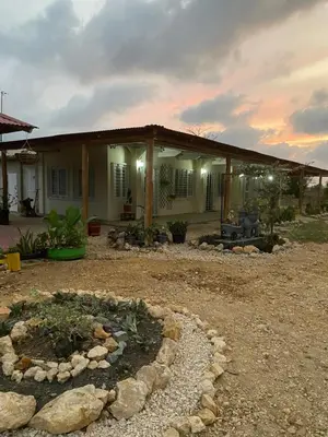 a house with a garden in front of it at Cabañas Paulamar - Apto 2 - Tolu in La Gloria