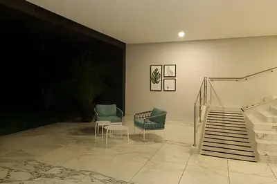 a room with some chairs and a stair case at Apartamento 1 Dormitorio Morros. Vista Mar Piscina in Cartagena de Indias