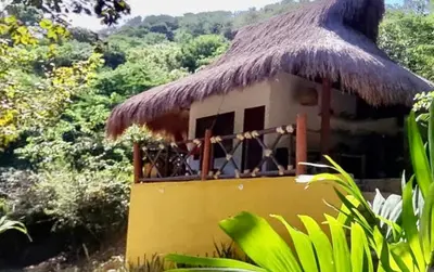 a small hut with a thatched roof at Kamajorú Ecohabitat in Tubará