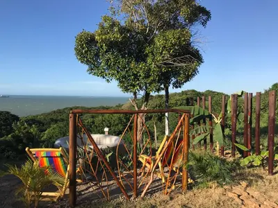 a wooden gate in front of a fence with a tree at Kamajorú Ecohabitat in Tubará