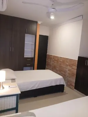 a hotel room with a bed and a bathroom at Apto amoblado barrio Los Alpes Cartagena in Cartagena de Indias