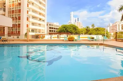 an empty swimming pool with buildings in the background at Laurdhomes Laguito Loft Hot Ware 1Bath, lake view in Cartagena de Indias