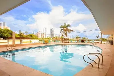 a swimming pool with a city skyline in the background at Laurdhomes Laguito Loft Hot Ware 1Bath, lake view in Cartagena de Indias