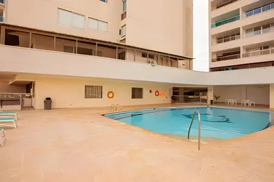 an empty swimming pool in an apartment building at Laurdhomes Laguito Loft Hot Ware 1Bath, lake view in Cartagena de Indias