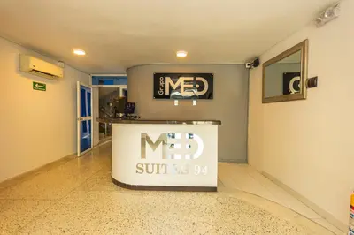 a lobby with a new sign on the wall at Hotel Med Suites 94 in Barranquilla