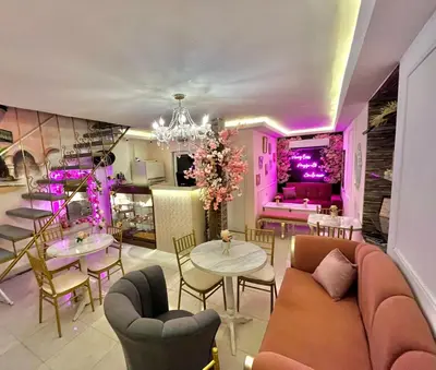 a living room with a couch and tables and chairs at CASA HADASA in Cartagena de Indias