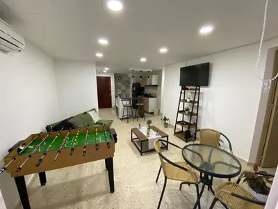 a living room with a table and a couch at Apartamento frente al mar en Cartagena in Cartagena de Indias