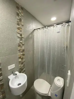a bathroom with a toilet and a sink and a shower at Apartamento frente al mar en Cartagena in Cartagena de Indias