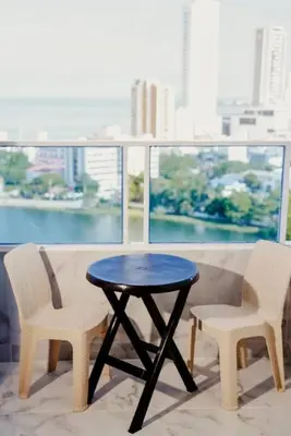 a table and two chairs in front of a window at Linda vista y excelente ubicación in Cartagena de Indias