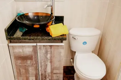 a small bathroom with a toilet and a sink at Linda vista y excelente ubicación in Cartagena de Indias