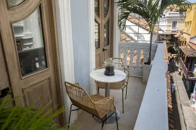 a small table and chairs on a balcony at Sol de Alba Hotel Boutique in Cartagena de Indias