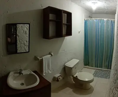 a bathroom with a sink and a toilet and a shower at Villa Margarita in Puerto Colombia