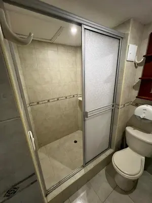 a bathroom with a shower and a toilet at Alojamientos Cartagena Edificio Atlantis y Conquistador in Cartagena de Indias