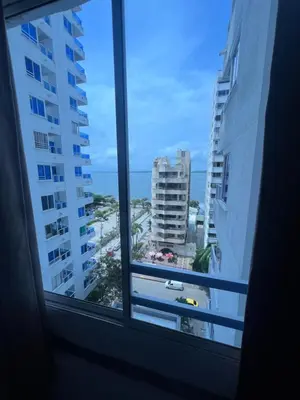 a window with a view of the ocean from aominiumominium at Alojamientos Cartagena Edificio Atlantis y Conquistador in Cartagena de Indias
