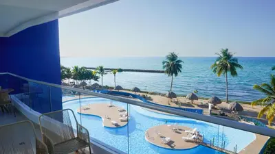 a view of the ocean from the balcony of a resort at Magico Apartamento Frente al Mar 4 Habitaciones PAZ345 in Coveñitas