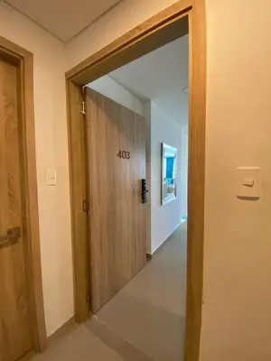 an empty hallway with a door with the number at Cartagena 3 habitaciones 9 personas cerca a la playa Wifi y Parqueadero in Cartagena de Indias