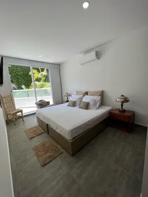 a bedroom with a large bed and a window at Cerca al Hotel Americas Ctgna Spiaggia Morros Piscina playa in Cartagena de Indias