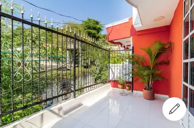 a balcony of a building with a fence and plants at Hostal-Mirador La Popa in Cartagena de Indias