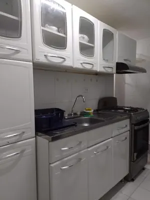 a kitchen with white cabinets and a sink at Cartagena Apartamento en Manga de 2 Habitaciones in Cartagena de Indias
