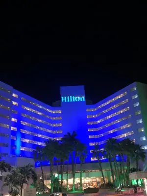 a hotel with blue lights on it at night at Apartaestudio in Cartagena de Indias