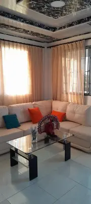 a living room with a couch and a glass table at VILLA MARIA in Turbaco
