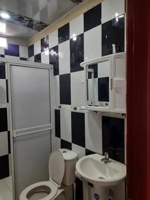 a bathroom with a toilet and a sink at VILLA MARIA in Turbaco
