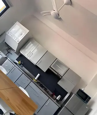 an overhead view of a kitchen with white appliances at 704 Puesta de sol apto en Cartagena in Cartagena de Indias