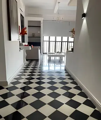 a hallway with a black and white checkered floor at 704 Puesta de sol apto en Cartagena in Cartagena de Indias