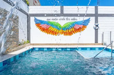 a swimming pool with make coffee for at COMFORT+TRANQUILIDAD=ROMÁNTICO APARTAESTUDIO CON PISCINA #6 in Santa Marta