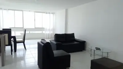 a living room with a couch and chairs and a table at Apartamento 3 Carabelas Cartagena Piso 16 in Cartagena de Indias