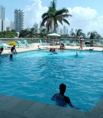 a group of people in a swimming pool at Apartamento 3 Carabelas Cartagena Piso 16 in Cartagena de Indias