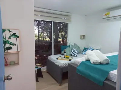 a room with a bed and a couch and a window at CABAÑA EN ISLA FRENTE A CARTAGENA in Cartagena de Indias