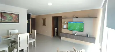 a living room with a television on a wall at Hermosa casa amoblada in Barranquilla