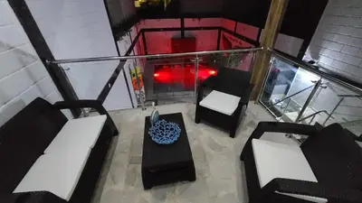 an overhead view of a living room with chairs and a table at Confort+Relax= Romántico ApartaEstudio + Piscina + Parqueadero in Santa Marta