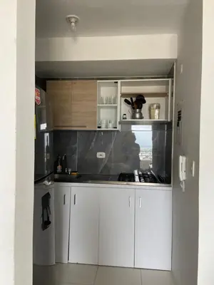 a kitchen with white cabinets and a counter top at Taller del artista II in Cartagena de Indias